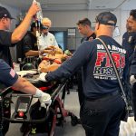 Boca Raton Fire Rescue Emergency Vehicle And Firefighter-Paramedics.