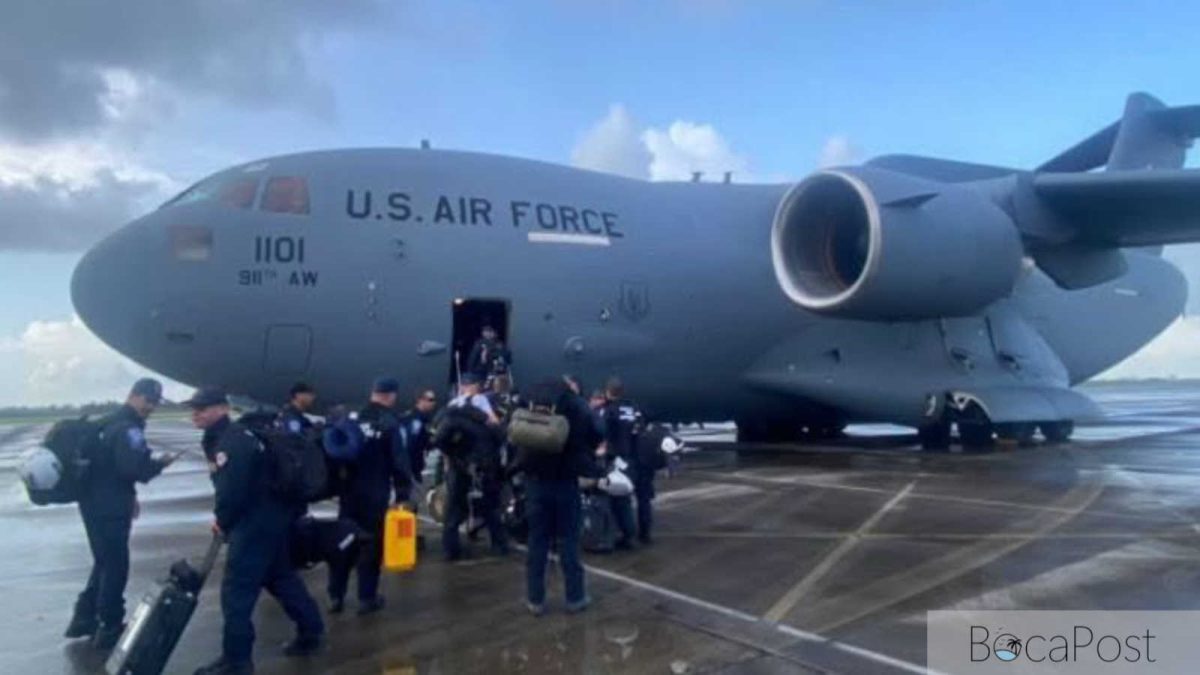 U.s. Air Force Aircraft On Tarmac With Florida Task Force 2 Rescue Personnel Boarding.