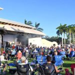 Audience Seated On The Lawn At Wellington Amphitheater During A Live Concert.