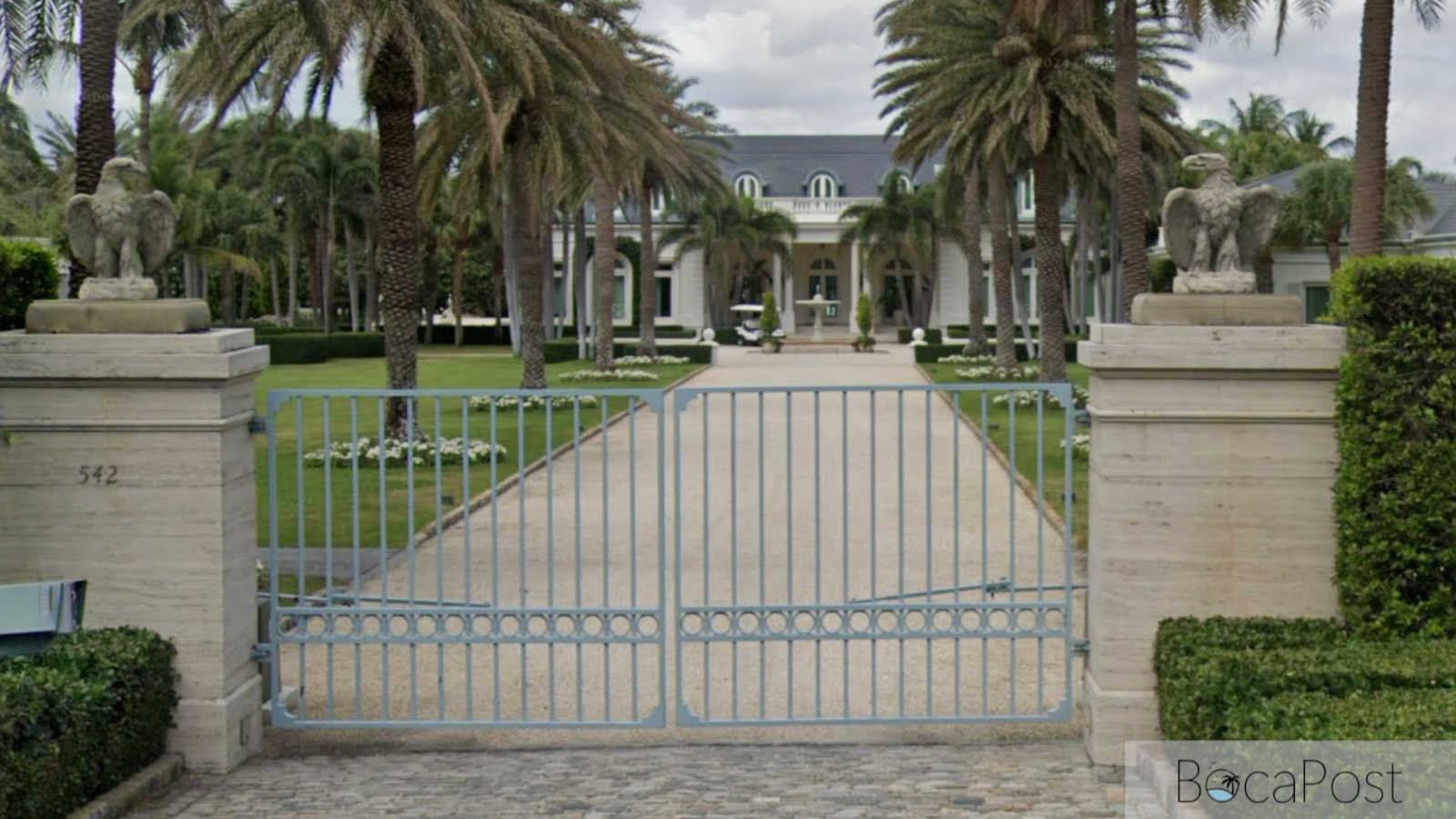 Street view of an oceanfront estate on North County Road in Palm Beach, Florida.