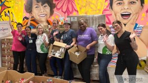 Volunteers Packing Cardboard Kidspack Food Boxes For The Boca Helping Hands Weekend Meal Program.