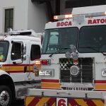 A Boca Raton Fire Rescue Engine Parked Outside A Fire Station.