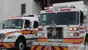 A Boca Raton Fire Rescue Engine Parked Outside A Fire Station.