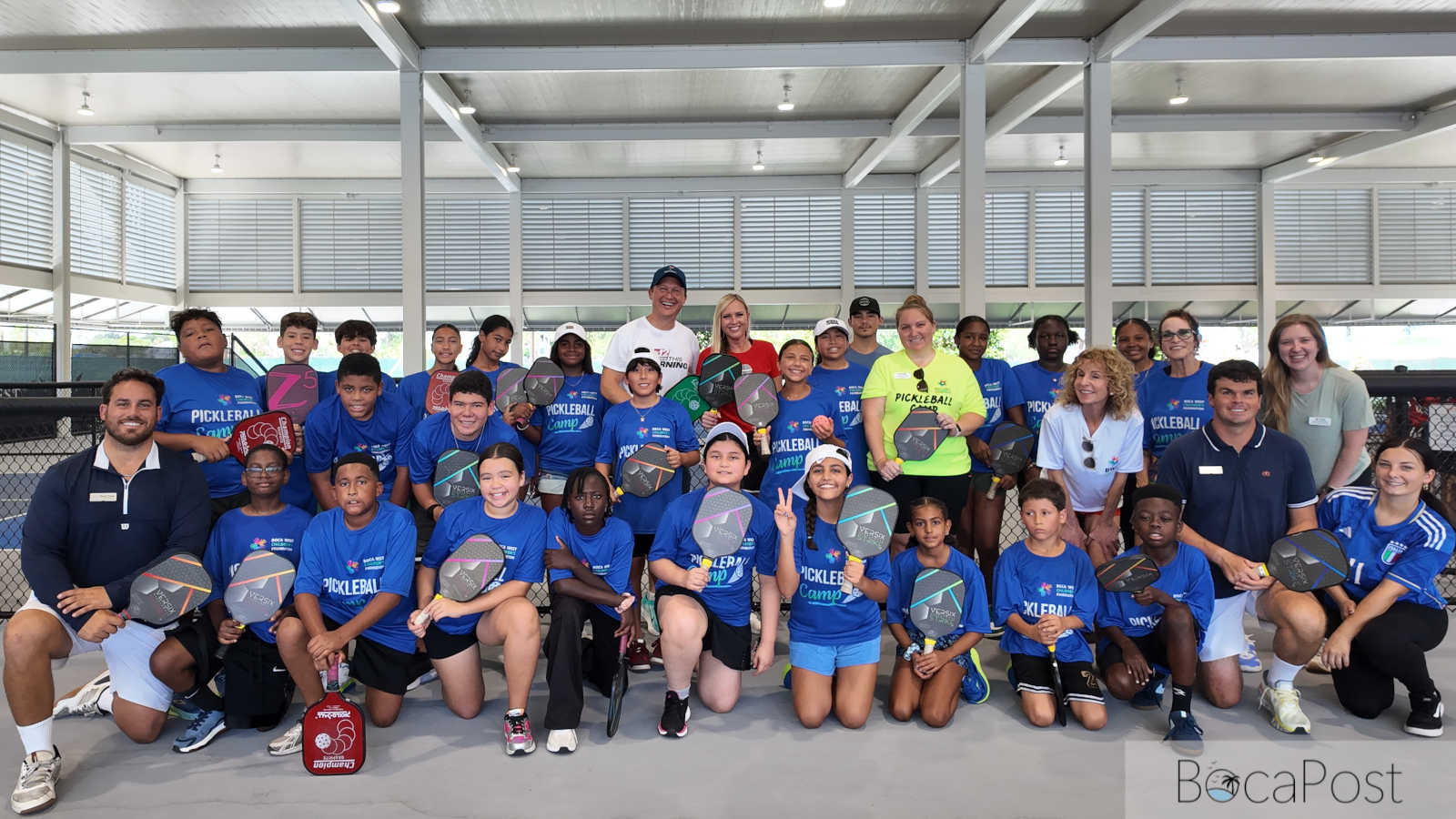 Boca West Club Hosts Free Pickleball Camp for 60 Fuller Center Kids Kids playing pickleball on covered courts at Boca West Country Club in Boca Raton during a free summer camp.