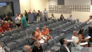 Boynton Beach City Hall Commission Chambers With Residents In Attendance During A Public Hearing.