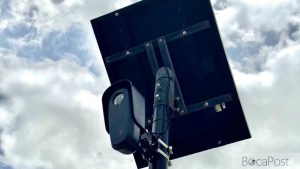 Flock Safety License Plate Reader Camera Mounted On A Pole Along A Coral Springs Street.