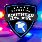 Close-Up Of Red And Blue Police Emergency Lights With The Operation Southern Slow Down Campaign Emblem Overlaid.